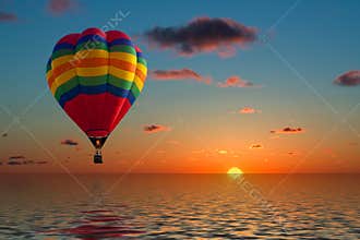 Balloon flying into sunset