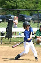 Boy Hitting Ball