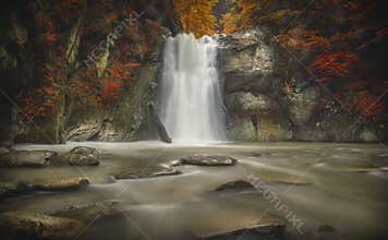 Waterfall, magical autumn forest, october season. Casoca waterfall from Romania.