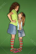 Girls standing face to face.