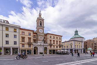 The central Piazza Tre Martiri square and the clock tower in the historic center of Rimini, Emilia Romagna, Italy