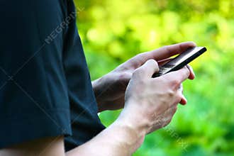 Hand with mobile phone