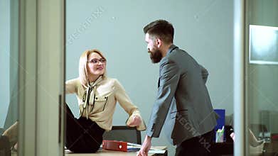 Sexy Secretary seducing her boss. Sexual harassment and office abuse concept. Young boss seduces female employee. Abuse