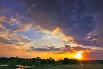 Beautiful sunrise and dramatic clouds on the sky.