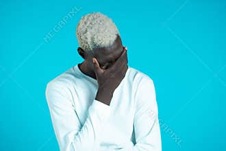 Portrait of young african man doing facepalm gesture, like no, I forgot. Unhappy black guy feeling sorrow, regret, drama