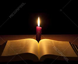 Candle and holy bible