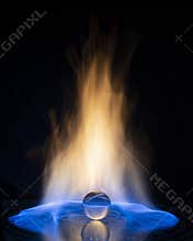 Glass ball with fire flames on black background