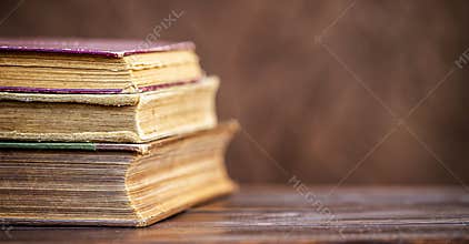 Old books on the table, back to school banner