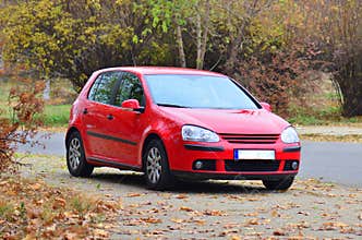 Red Volkswagen GTI Golf car