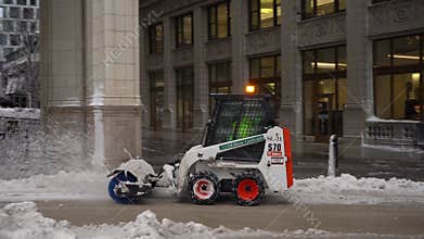 CHICAGO, USA - JANUARY 28, 2021: Sidewalk Snow Plow on a Winter Day