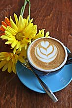 Coffee with heart image and flowers.