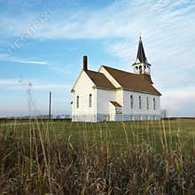 Rural church in field.