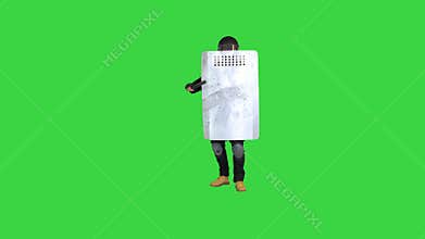 Policeman with full equipment for anti-riot making steps towards the camera with the shield up on a Green Screen, Chroma