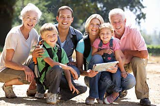Three generation family walking in country