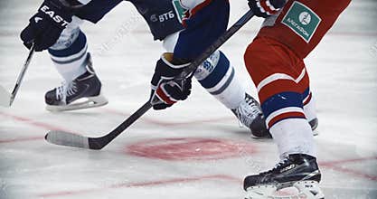 Ice hockey game championship. Player does dribbling. Possession of the puck. Winter sport concept. Professional league