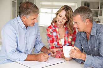 Mid age couple with financial advisor