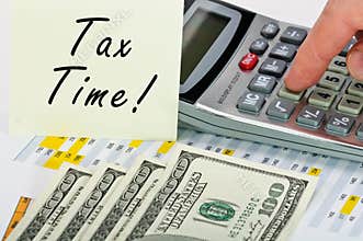 Tax time stiker and financial forms.