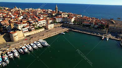 Sardegna (Sardinia) island landmarks. Charming historic Alghero. Aerial drone 4k hd video