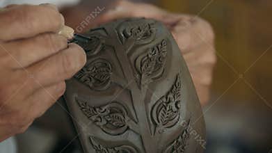 Pottery product with engravings made by sharp tool