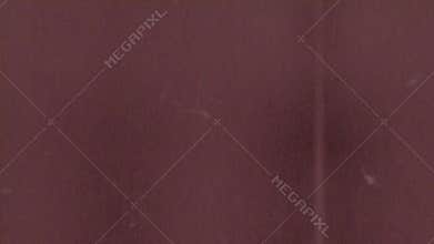 Vibrant red surface with intriguing brown spots
