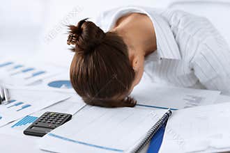 Woman sleeping at work in funny pose