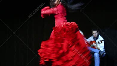 Woman in red dress dances in House Flamenco