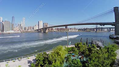 Vessel sails down the East River under Brooklyn