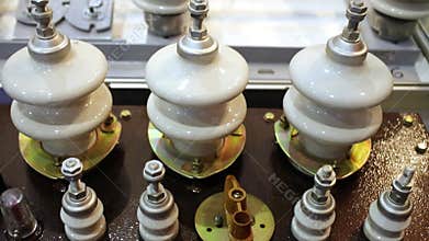 Ceramic insulators of different sizes mounted on