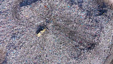 Slow motion view of large garbage pile, trash dump, landfill, waste dumping site aerial