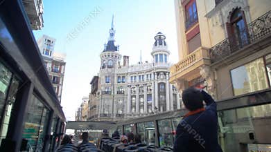 Visiting Madrid in a city bus tour on a sunny
