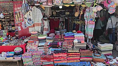 Clothing Shop Displaying Variety of Apparel Beside Collectible Shop Dharamshala