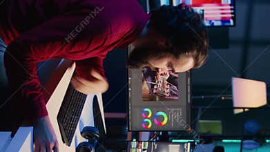 Vertical video Videographer filming internet guide on video footage correcting