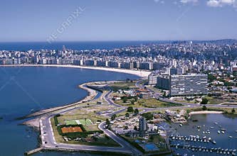 Uruguay aerial view of the city of Montevideo, the picturesque Pocitos beach and the Aresanal del-Buceo port