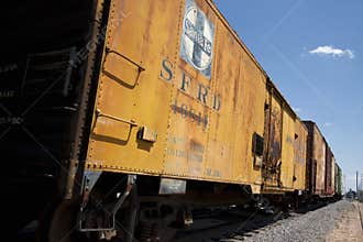 Yellow railroad freight cars