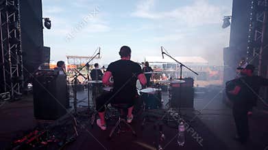 2021-08-08 - Mariupol City Festival, Ukraine. Band Shmalgauzen performs on stage at outdoor music festival. Musicians