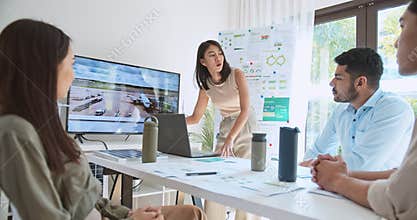 Asian businesspeople in team meeting, using laptop computer presentation on Solar cell panel usage in Airport