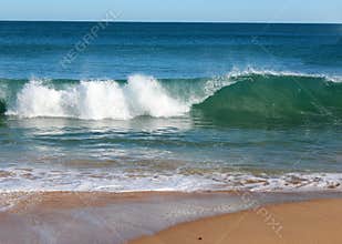 Indian Ocean waves rolling in at pristine Binningup Beach Western Australia on a sunny morning in late autumn.