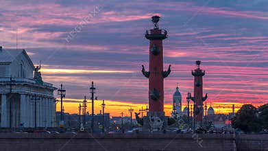 Sunset over Strelka - Spit of Vasilyevsky Island with Rostral Columns timelapse in Saint Petersburg, Russia
