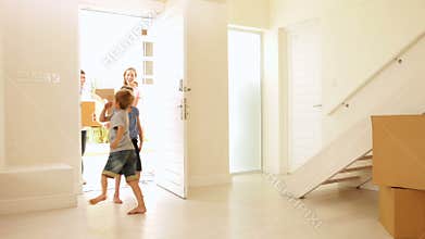 Happy family moving into their new home