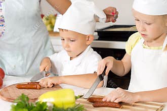 Young children learning to cook