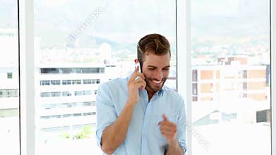 Happy businessman dancing after getting good news