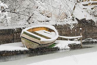 Wooden Boat Covered by Snow in Mid-Winter