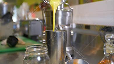 Pouring Fresh Citrus Juice Mix Into Stirring Mug