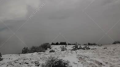 Winter landscape in mountains with clouds