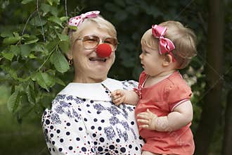 Woman is entertaining her little granddaughter