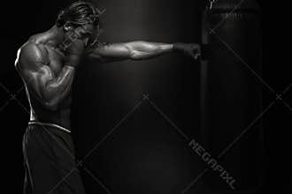 MMA Fighter Practicing With Boxing Bag