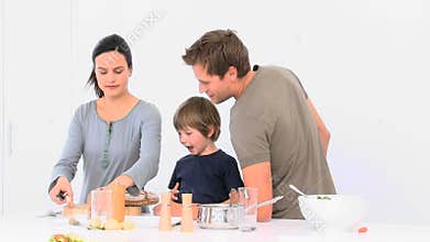 Woman cutting bread during the lunch preparation
