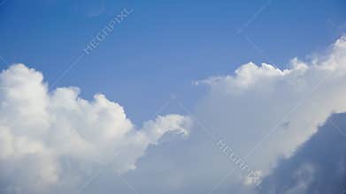 Clouds moving in blue sky