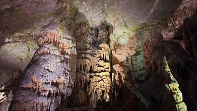 Impressive stalactite and stalagmite formations inside the caves of Postojna, Slovenia.