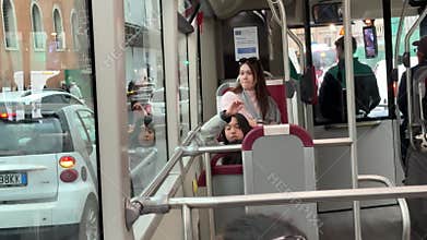 Rome, Italy 12.16.2025 Traffic near the Colosseum in Rome Italy with buses on routes bas motorcycles taxis and scooters